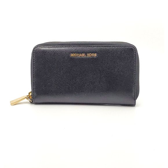 Michael Kors Handbags - NWD Michael Kors Jet Set Travel Large Pebbled Leather Wristlet $228.00